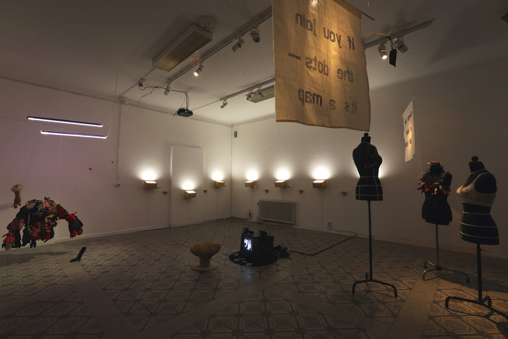 installation view&amp;ndash; armour, video work, brassiere text work, dust light boxes, fabric banners